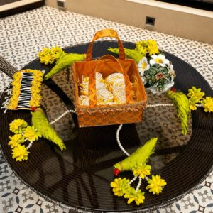 handcrafted haldi ceremony floral basket set with decorative parrot accents